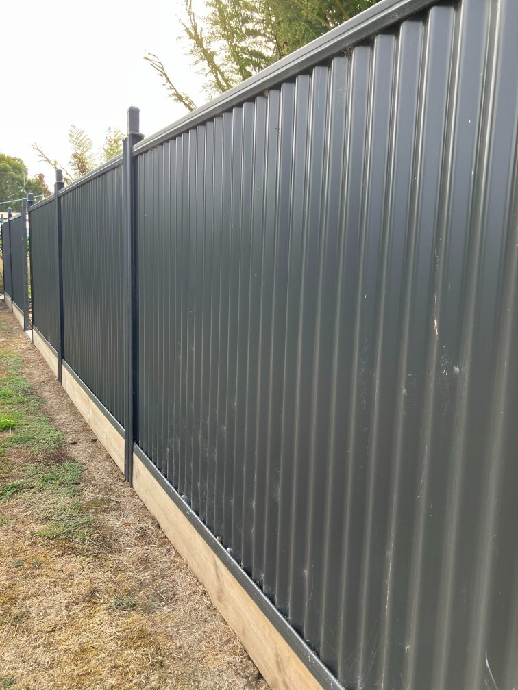Colorbond steel boundary fence installed along a residential property line
