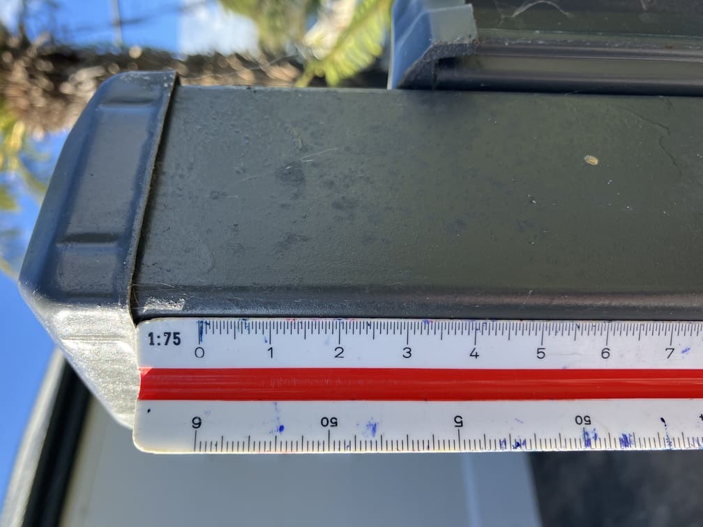 Measuring the height of a fence before estimating materials